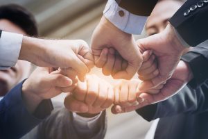 Business People Joining Hands Showing Teamwork